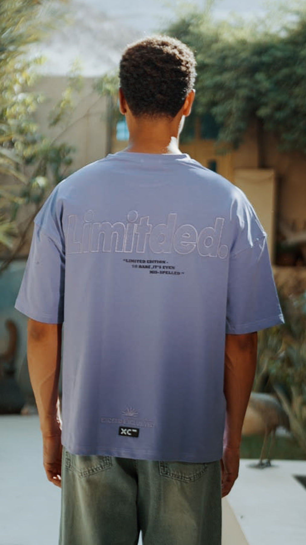 PURPLE MIS-SPELLED TSHIRT XC 500